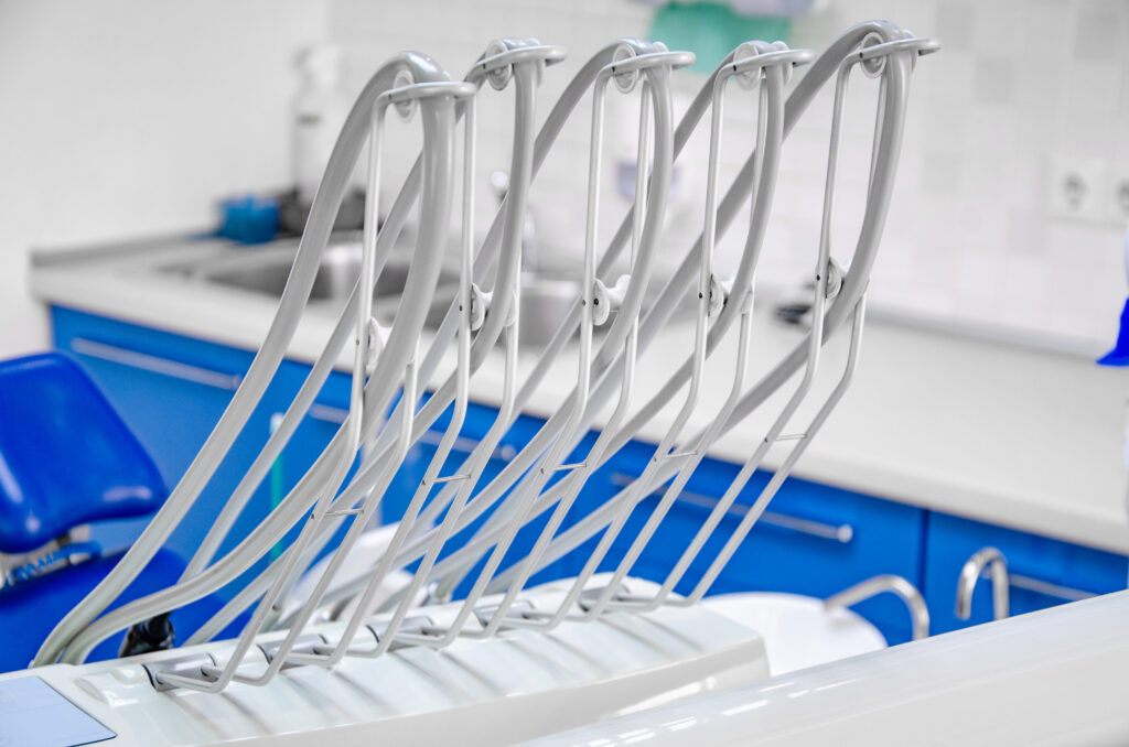 Dental instrument air tubes on a dentist chair.